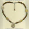 Fossilized coral and shell necklace with handmade sterling silver accents. - Click for a larger picture