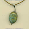 Peruvian turquoise pendant with handmade sterling silver findings.				
 - Click for a larger picture