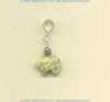 Fossil coral Zuni bear split bail pendant with handmade sterling silver coil bead accent.				
 - Click for a larger picture